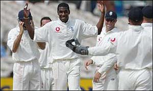 Alex Tudor takes a wicket at Old Trafford