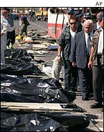 Ariel Sharon looks at body bags