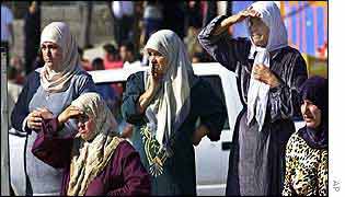 Arab women look towards the site of the blast