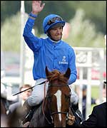 Frankie Dettori celebrates victory on Grandera