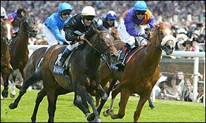 Just James ridden by Olivier Peslier (centre) beats Steenberg to win the Jersey Stakes 