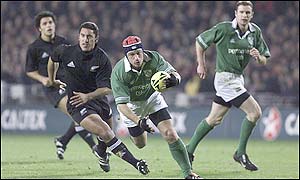 Ireland's David Humphreys breaks away from New Zealand's Daryl Gibson