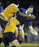 France forward Olivier Magne tries to get the ball away under pressure