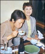 Japanese diners eating in whalemeat restaurant
