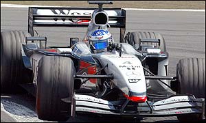 McLaren's Kimi Raikkonen beat Ralf Schumacher into fourth place 