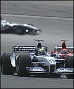 Ralf Schumacher heads Michael Schumacher in the early laps with David Coulthard looming up behind