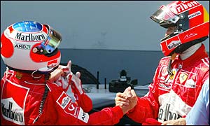 Rubens Barrichello and Michael Schumacher congratulate each other