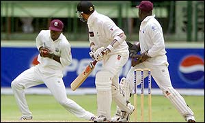 Carl Hooper hangs on to an edge from New Zealand nightwatchman Daryl Tuffey