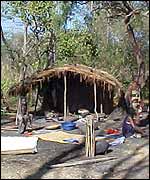 Villagers in front of their shelter