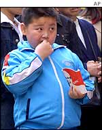 Chinese boy eating fast food