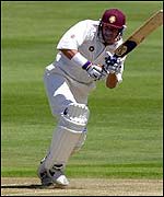 Mike Hussey plays the ball through mid-wicket