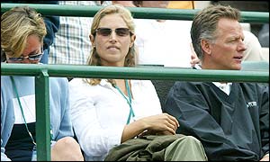 Henman's wife Lucy watches him in action from the players' box