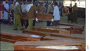 Coffins containing the dead are lined up