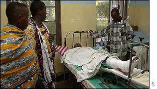 A survivor is visited in hospital by relatives