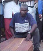 Ahmad Salehe with his brother's coffin 