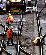 Engineers examine the tracks and points at Potters Bar