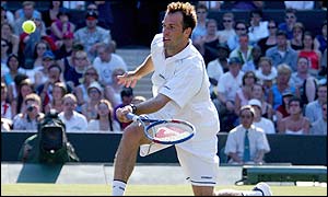Greg Rusedski races to the net
