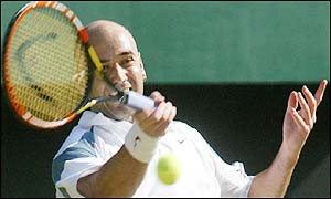 Andre Agassi smashes the ball back to his opponent