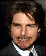 Tom Cruise shows off his brace
