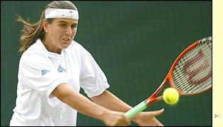 Spain's Conchita Martinez eases to a 6-1 6-3 victory over Switzerland's 17th seed Patty Schnyder