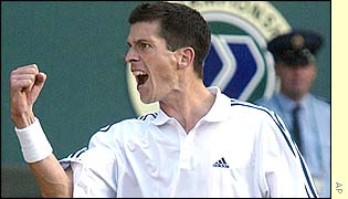 Henman celebrates his 3-6 6-3 6-4 6-3 win over Scott Draper