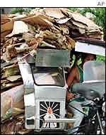 Recycling cardboard in the Philippines, AP