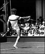 John McEnroe kicks a racquet 