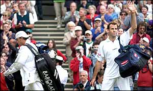Rusedski waves to the crowd as he leaves Centre Court