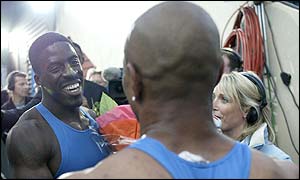 Dwain Chambers is congratulated by Olympic champion Maurice Greene after beating the American in the 100m