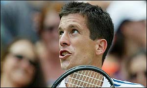 Henman argues a call with the umpire