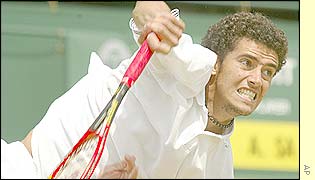 Andre Sa plays another powerful serve