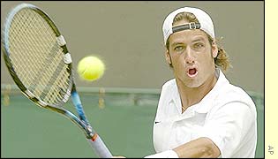 Feliciano Lopez plays a strong backhand across the court