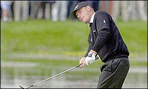 Alex Cejka attempts to play the ball out of the water