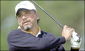 Eduardo Romero plays a shot onto the green