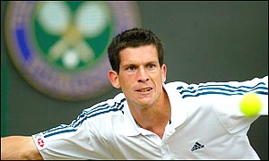 Henman stretches to reach a forehand