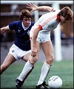 Tommy Coyne holds off John McLelland