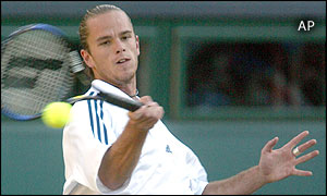 Belgium's Xavier Malisse returns to Britain's Greg Rusedski