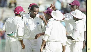 The West Indies captain Carl Hooper celebrates taking the wicket of New Zealand's captain Stephen Fleming