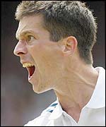 Tim Henman shouts in triumph