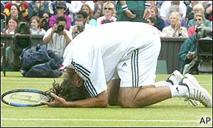 Xavier Malisse falls to his knees after beating Rusedski