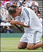 Xavier Malisse sinks to his knees after he beats Greg Rusedski