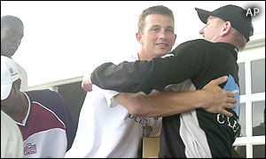 New Zealand bowler Shane Bond is hugged by Scott Styris