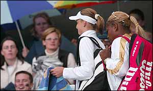 Hantuchova and Williams leave the court