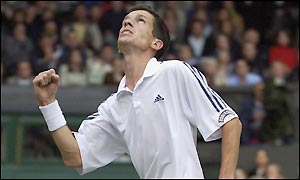 Tim Henman celebrates breaking Andre Sa