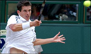 Henman adopts a more aggressive attitude to take the third set