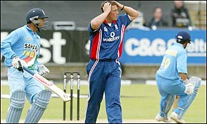 Darren Gough holds his head in his hands as India's batsmen punish his bowling