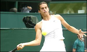 Amelie Mauresmo plays Serena Williams in the semi-finals at Wimbledon