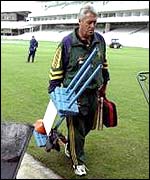 Bob Woolmer carrying practice equipment