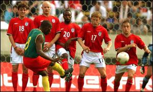 Geremi takes a free-kick against England in a friendly 