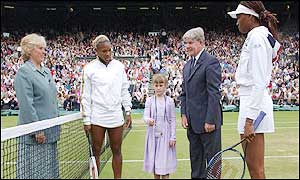 Six-year-old Shayna Godin tosses the coin at the start of the women's final